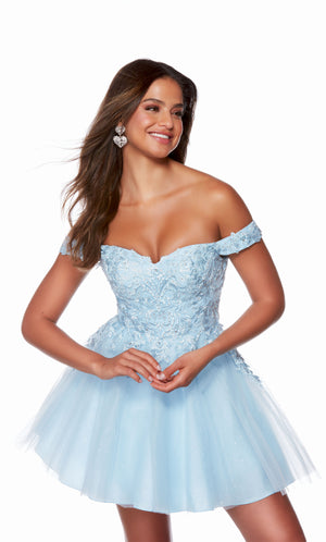 A light blue, off the shoulder homecoming dress adorned with delicate lace overlay and featuring a full tulle skirt. Shop our latest collection of gorgeous designer dresses by ALYCE Paris.