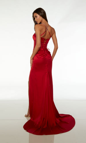 Red satin gown: Plunging sheer corset top, high slit, ruching detail, train, and detachable side train for added drama and flair to the elegant look.