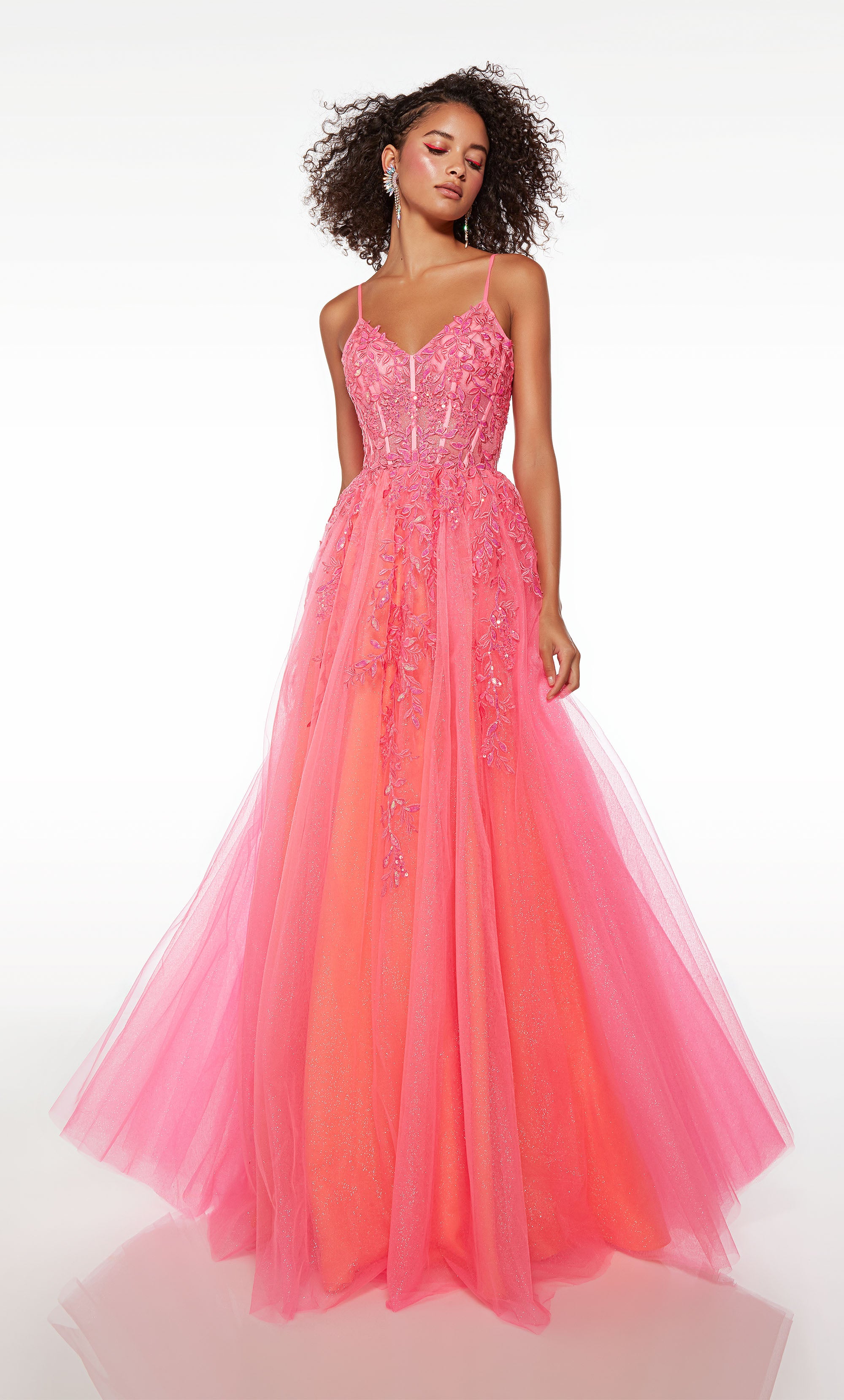 Stunning pink corset prom dress with an V-neckline, delicate floral lace appliques, lace-up back, and an flowy tulle skirt for an enchanting and elegant look.