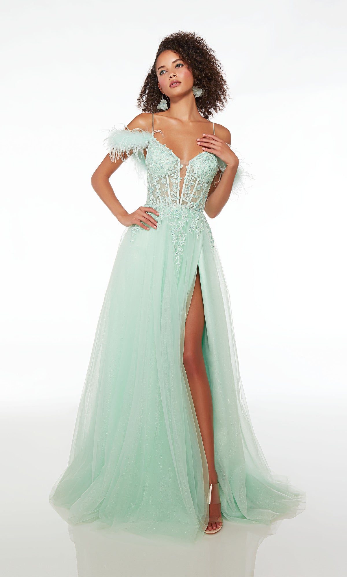 Green prom dress: sheer lace corset, high slit, detachable feather straps, A-line glitter skirt, crisscross lace-up back, and an train for an stylish look.