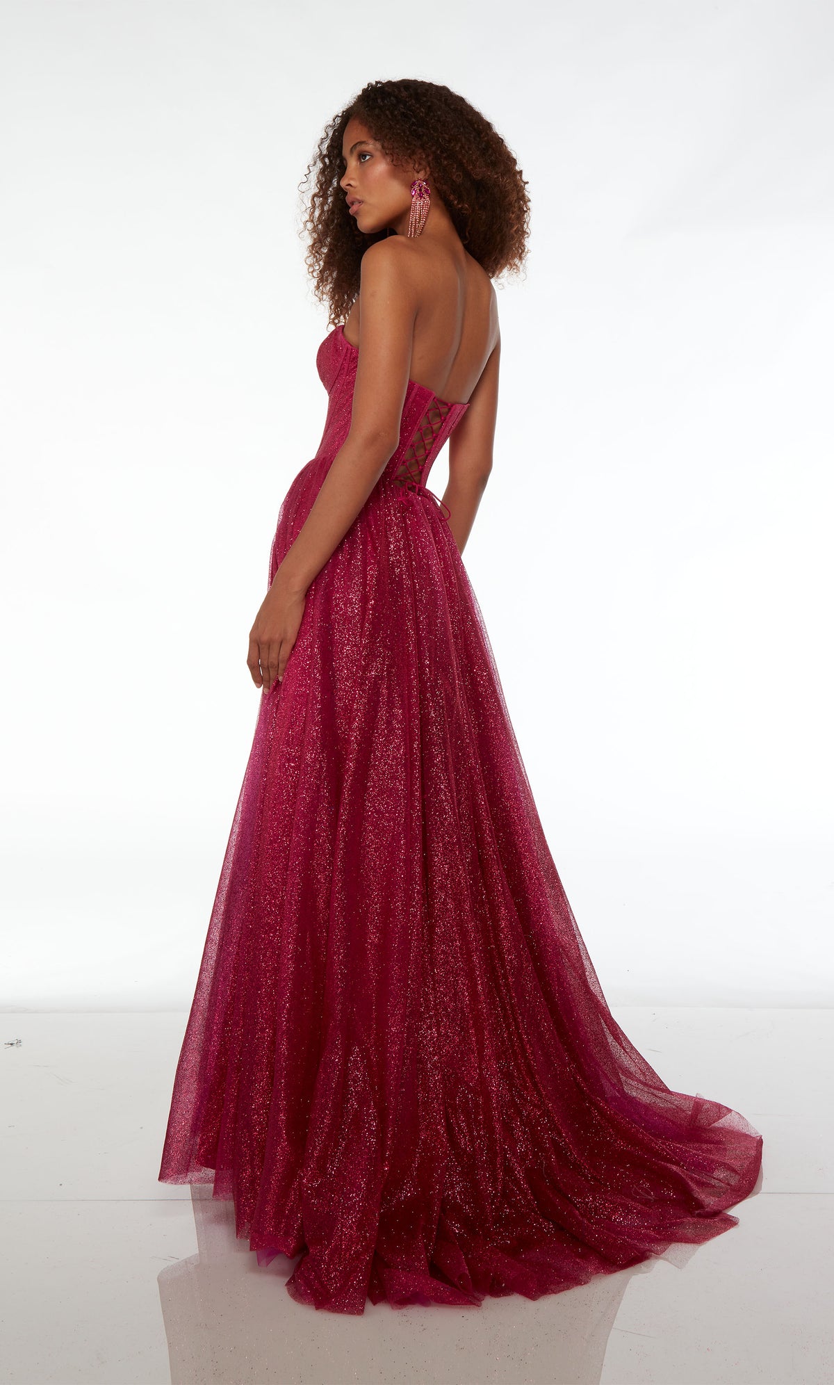 Raspberry pink A-line formal dress in glitter tulle: sweetheart neckline, corset top, side slit, lace-up back, and train for an stylish and elegant look.