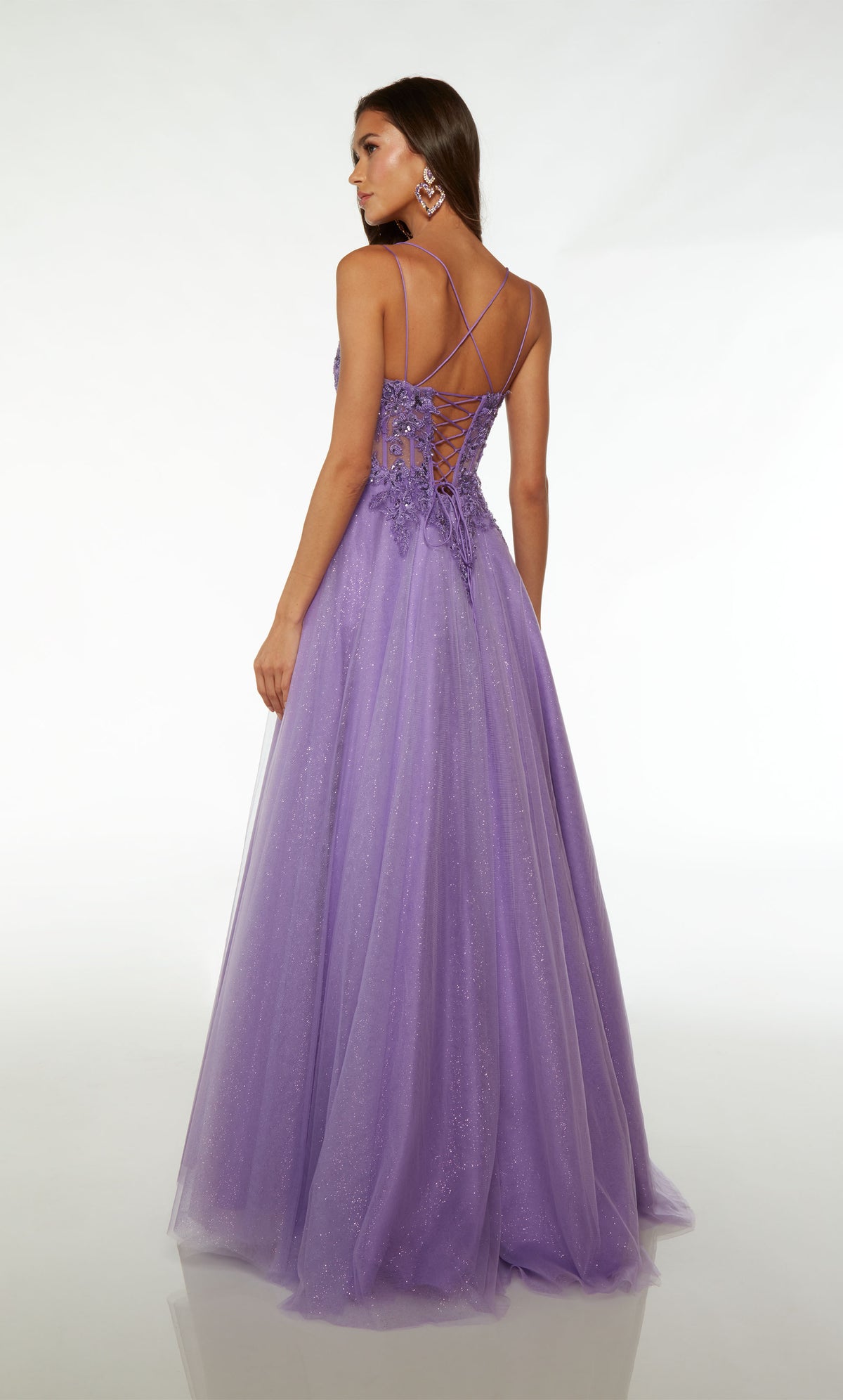 Pretty glitter tulle purple ball gown with an sheer corset bodice, sequined floral lace appliques, dual spaghetti straps, crisscross lace-up back, and an slight train.