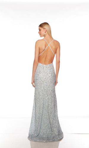 Light blue sequin gown with an V neckline, slit, and crisscross adjustable strap back, and an slight train for an elegant and alluring look.