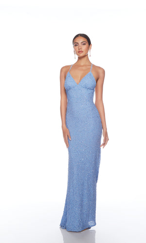 Light blue sequin gown with an V neckline, slit, and crisscross adjustable strap back, and an slight train for an elegant and alluring look.